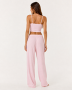 Conjunto em malha com camisola curta e calças largas