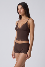 Conjunto suave de camisola e calções com renda ondulada